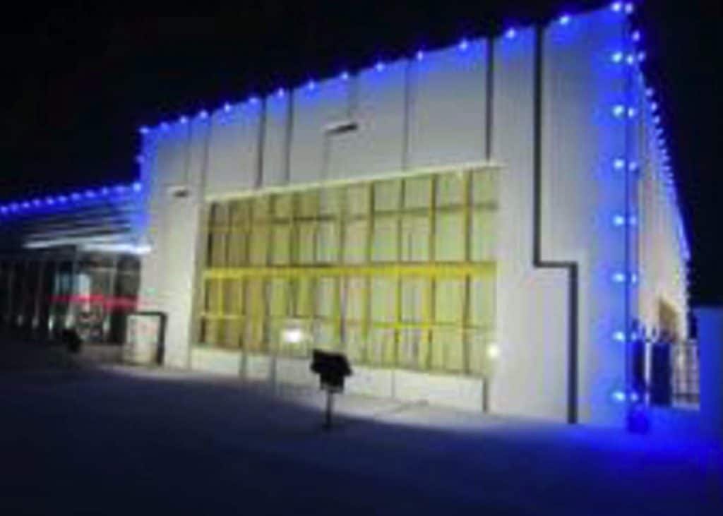 The building where the hotel is located, adorned with stunning garden lights that enhance its architectural beauty.