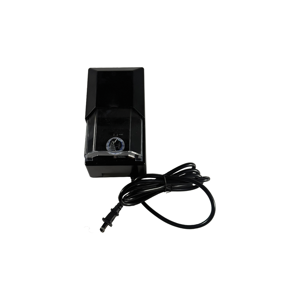 The Plastic Transformer is a black electric pencil sharpener with a transparent shavings compartment, attached power cord, and built-in transformer, displayed against a plain white background.