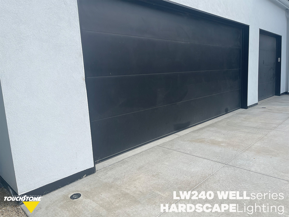 HARDSCAPElighting 4 A black garage door with the words lw240 series hardscape lighting.