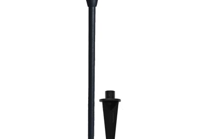 The Commander is a black outdoor pathway light with a wide, conical shade, long post, and a separate pointed ground stake for easy installation.
