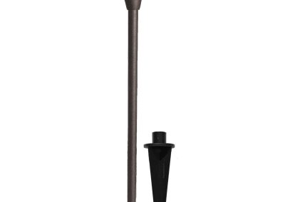 The Commander is a bronze-colored outdoor path light with a conical shade, pictured beside a black ground stake for installation.