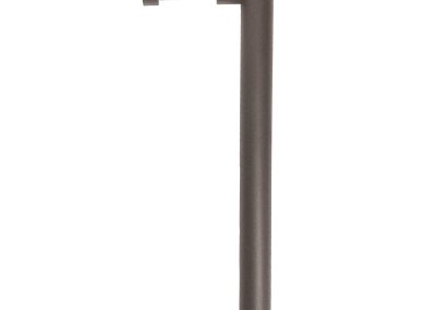 The Tubelle is a brown L-shaped outdoor pathway light with a flat LED panel on the upper horizontal section, shown on a white background.